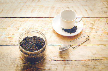 Tea set on the wooden table at sunny morning