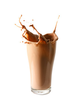 Splash of chocolate milk from the glass on isolated white  background.