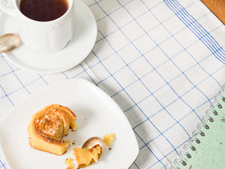 Home made roll buns  made of mixed wheat and corn flour for breakfast on white checkered table cloth