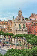 Aerial view on the famous Roman landmark Triumphal Trajan's Column (Colonna Traiana).Church Santa...