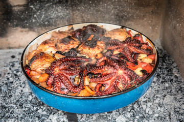 Preparing and Cooking of octopus and chicken in traditional Balk