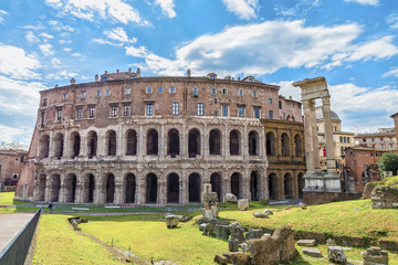Fototapeta na wymiar Beautiful panoramic view on the ancient Theatre of Marcellus( Teatro di Marcello ) at sunny day. Scenic architectural and natural landscape Rome.Italy.Europe.