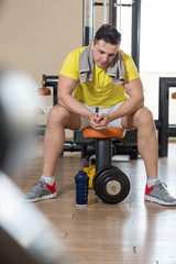 Athlete muscular brutal bodybuilder emotional posing in the gym,