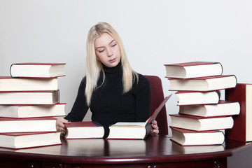 student learning with lot of books