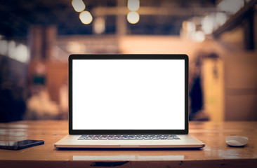 Fototapeta Laptop with blank screen on table. obraz