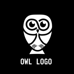 Owl logo in black background
Creative owl sitting in the darkness of night logo
