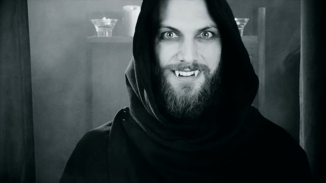 Happy vampire showing fangs getting angry