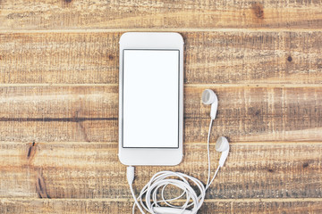 White smartphone with headphones