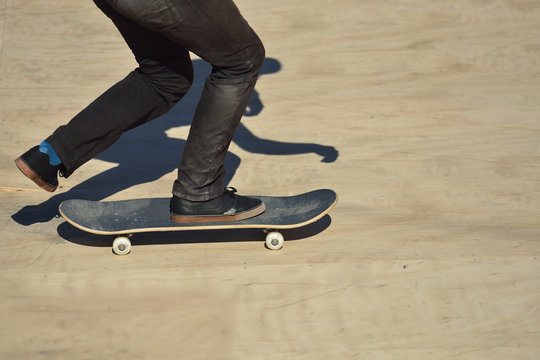 Closeup View of a Skateboarder Doing some Tricks