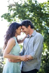 Fototapeta premium Couple hugging at park