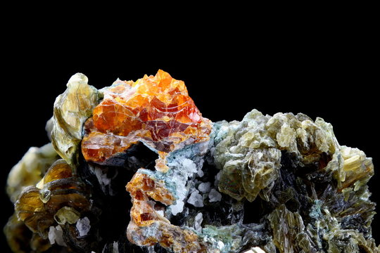Minerals: red clinohumite and green mica