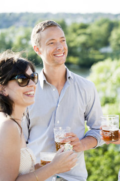 Young couple laughing in backyard