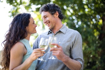 Happy couple holding wineglasses