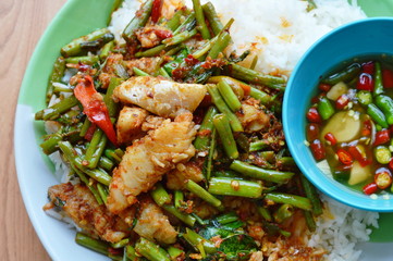 spicy stir-fried morning glory with dolly fish on rice