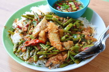spicy stir-fried morning glory with dolly fish on rice