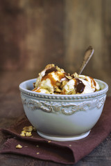 Vanilla ice cream with nuts,chocolate and caramel.