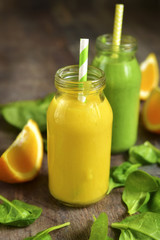 Two variations of fruit and vegetable smoothies.