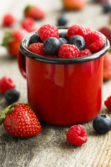 Summer berries in red mug