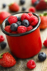Summer berries in red mug