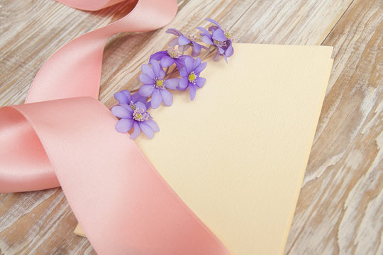 pink baby's greeting card, ribbon. purple little flowers,  blank