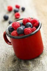 Summer berries in red mug