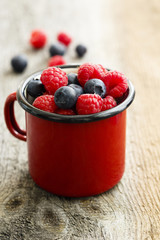 Summer berries in red mug