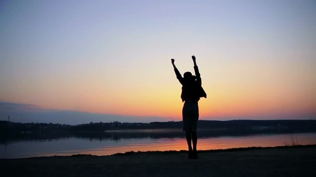 Happy Woman Jumping in Sea Sunset - slow motion