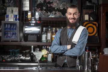 Barman serving cocktail.
