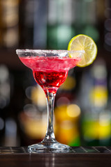 Cocktail garnished with lime.