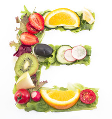 Letter E made of salad and fruits