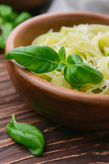Pasta with chicken and vegetables on  wooden background