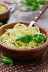 Pasta with chicken and vegetables on  wooden background