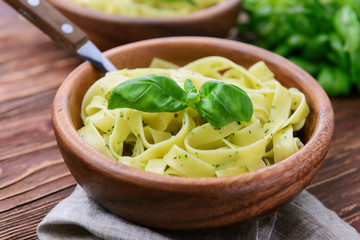Pasta with chicken and vegetables on  wooden background