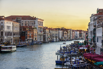 Canal with gondolas sunset scene, Venice, Italy.