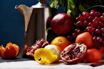 Classical composition: Basket of grapes, oranges and teapot