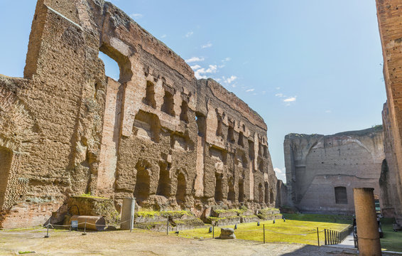 Panoramic view on old swimming pool ( or Natatio ) in the scenic ruins of ancient Roman Baths of Caracalla ( Thermae Antoninianae ),at summer sunny day.Built between AD 212 - 217. Rome. Italy. Europe.