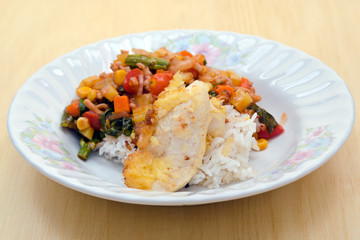 Fried chicken with vegetable tomato sauce and herb (famous thai