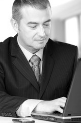 Businessman working on notebook in his office.