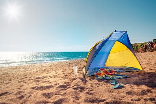 Fototapeta Beach scene with a beach tent
