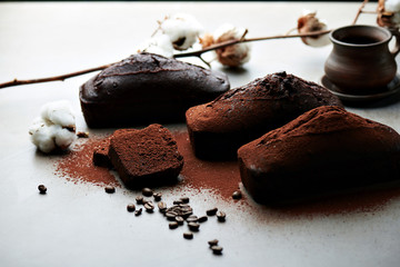 Tasty chocolate cake and cotton flowers
