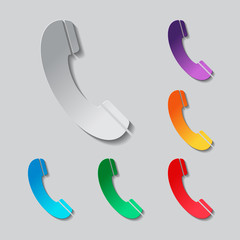 Telephone receiver icon set. paper design with colored objects