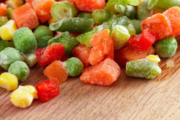 Frozen vegetables on cutting board