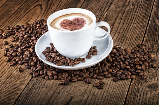 Coffee cup cappuccino on dark wood
