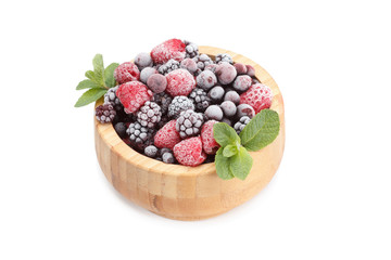 Frozen berries in wooden bowl, covered with ice