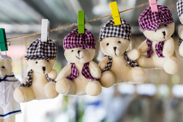 many teddy bear Hanging on a rope