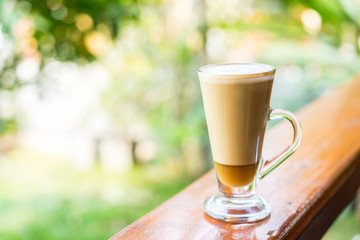 latte coffee cup on wooden table ,soft focus