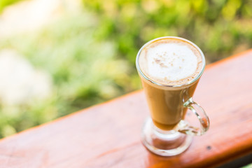 latte coffee cup on wooden table ,soft focus