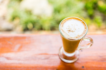 latte coffee cup on wooden table ,soft focus