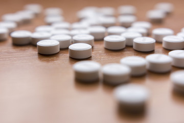 Medicines on wood background