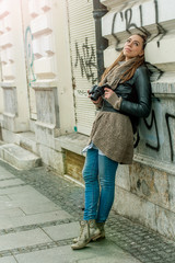 Female Tourist Photographer / Pretty young female tourist photographer taking pictures in the city